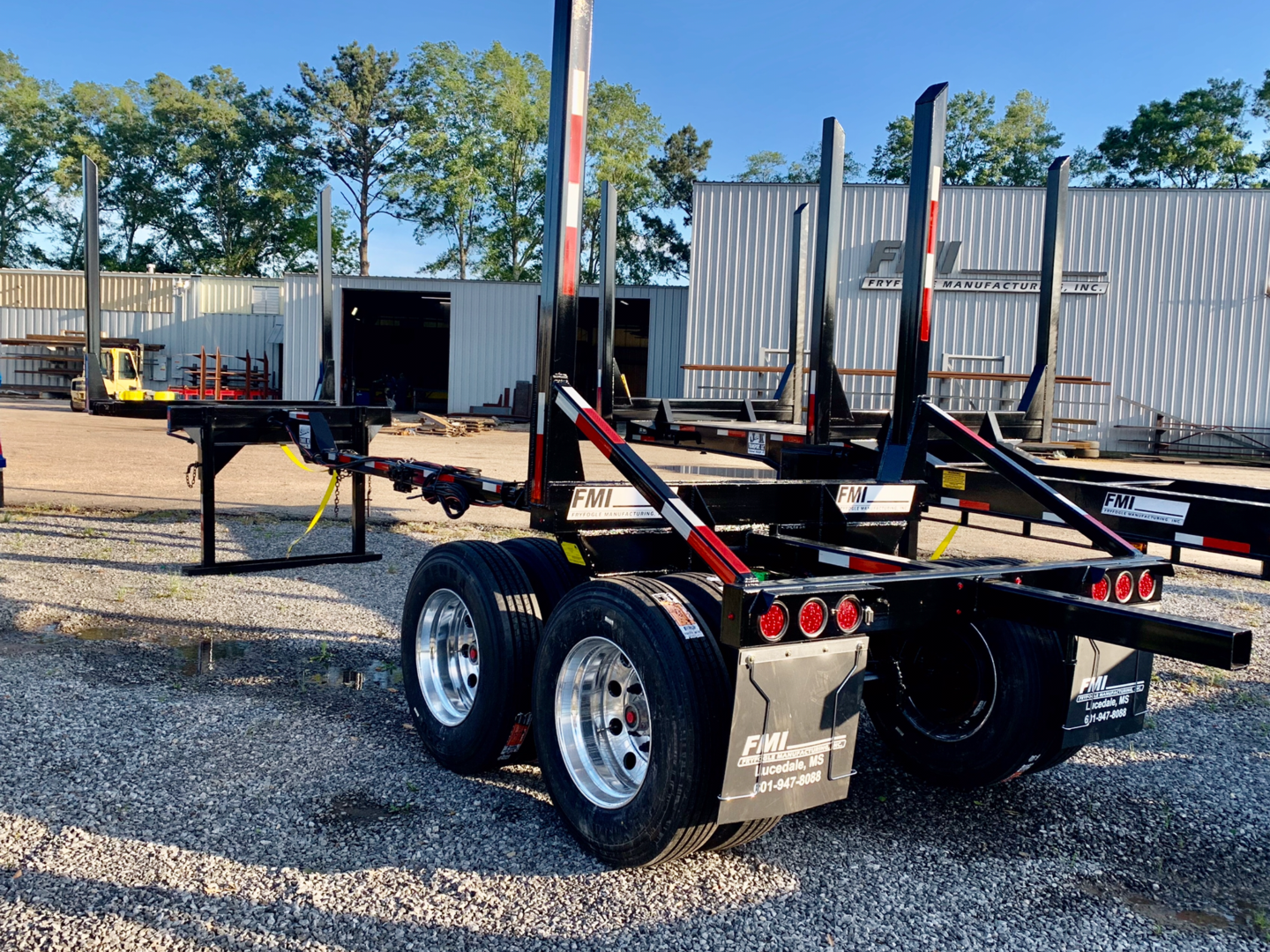Black log trailer with dual polished wheels